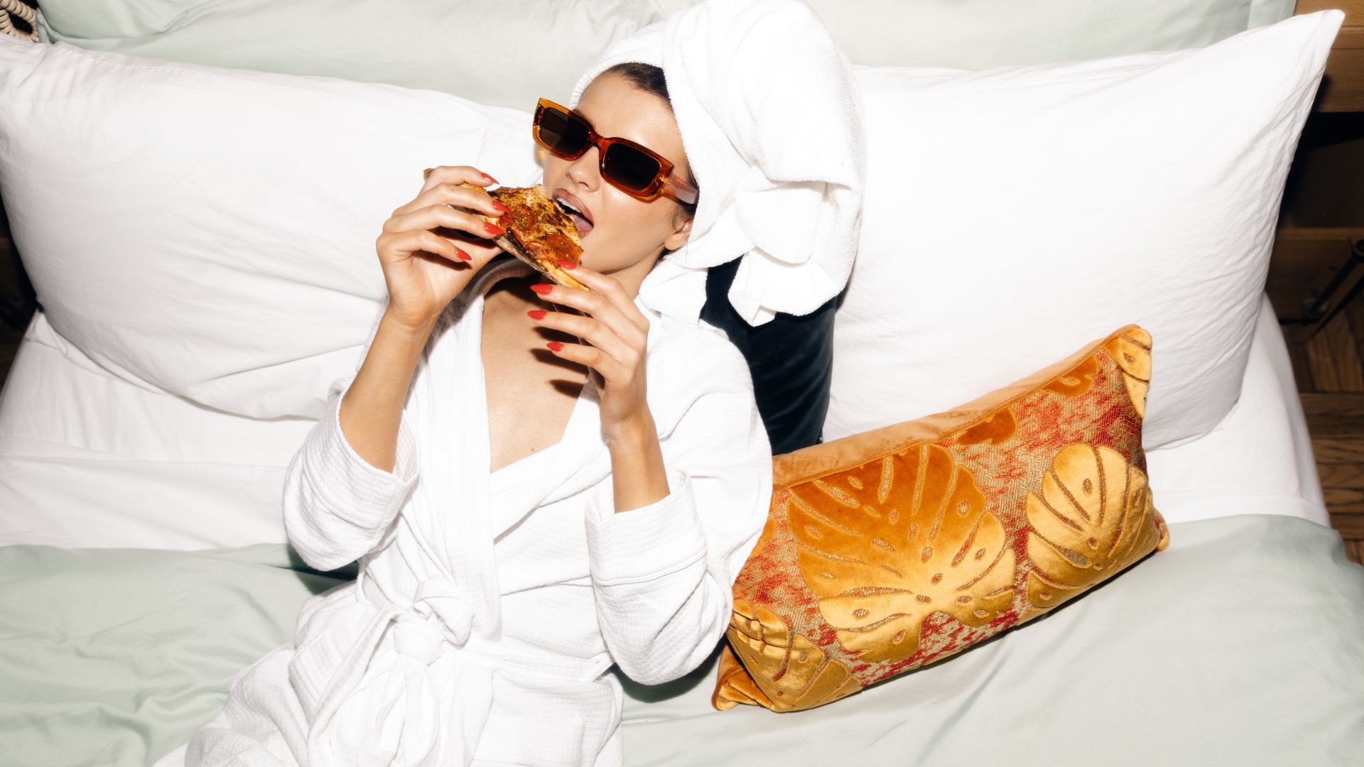 guest eating pizza in hotel